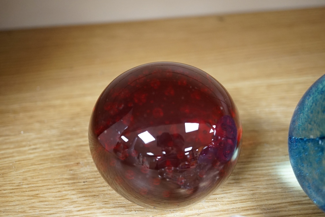 A collection of glass paperweights to include Caithness and millefiori examples, largest 10cm high